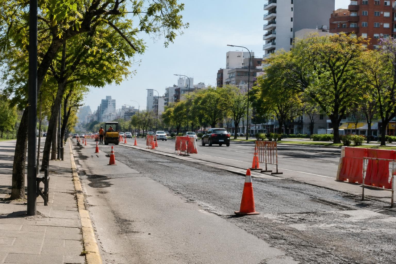 An urban avenue with cones and roadworks, illustrative of a traffic closure.